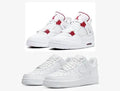 White Nike Air Force 1 Low with Red Maple Leaf Accents – Classic white low‑top sneakers .